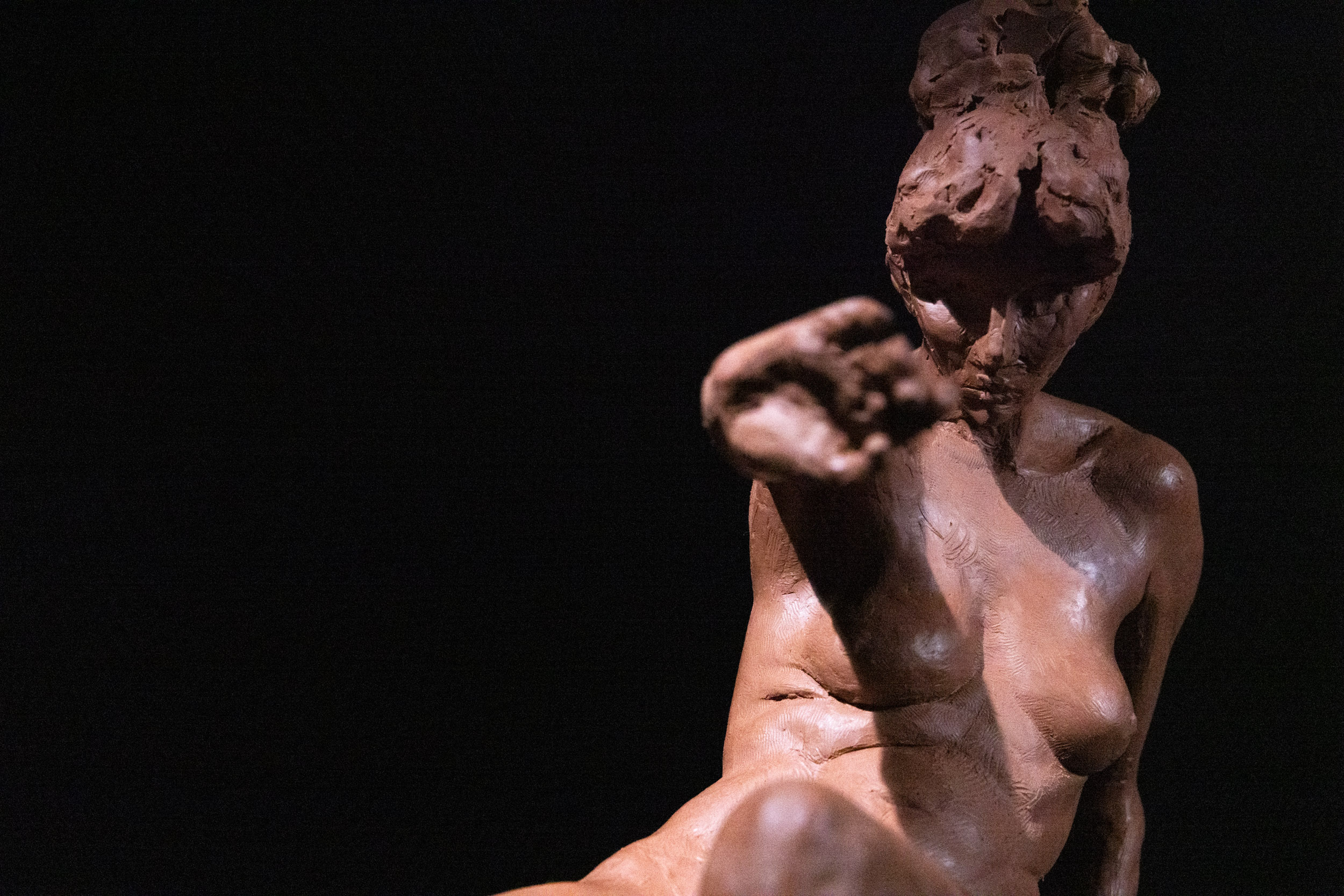 Seated figure study sculpture observational view