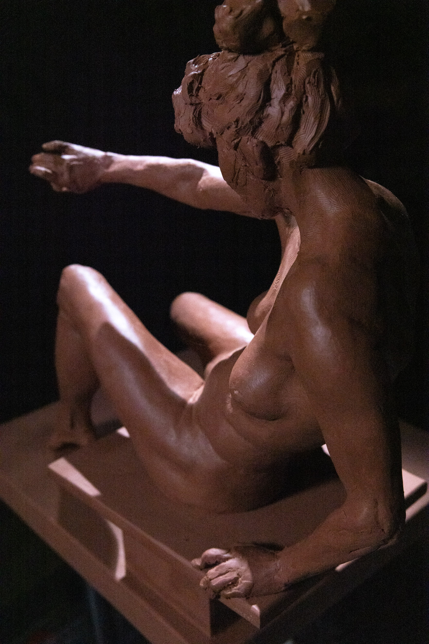 Seated figure study sculpture full figure view